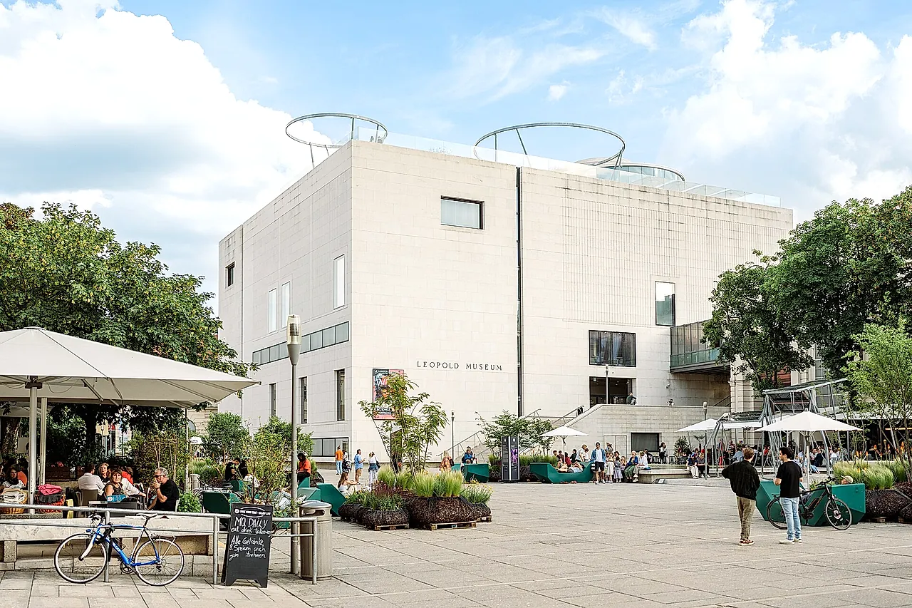 The white cube of the Leopold Museum above the main courtyard of the MuseumsQuartier, with its terrace and trees