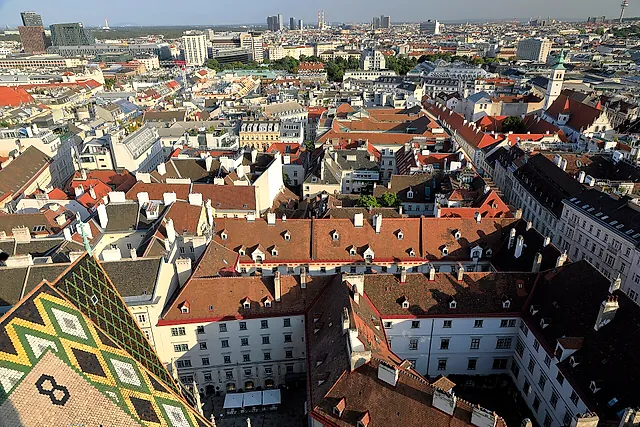 The roofs of Vienna’s old town seen from St Stephen’s Cathedral, with the diamond-patterned cathedral roof in front
